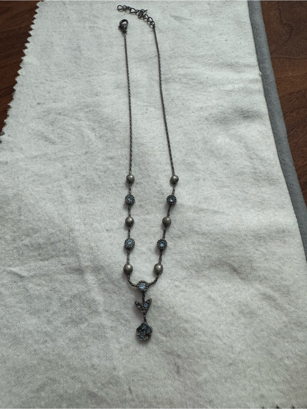 Vintage 1928 Brand Silvertoned Flower/Blue Crystal Y Necklace *READ*